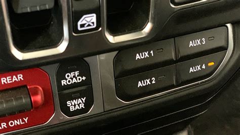 On the passenger side of the vehicle locate the rivets holding on the inner-fender splash guard. . Jeep jl aux switches wiring